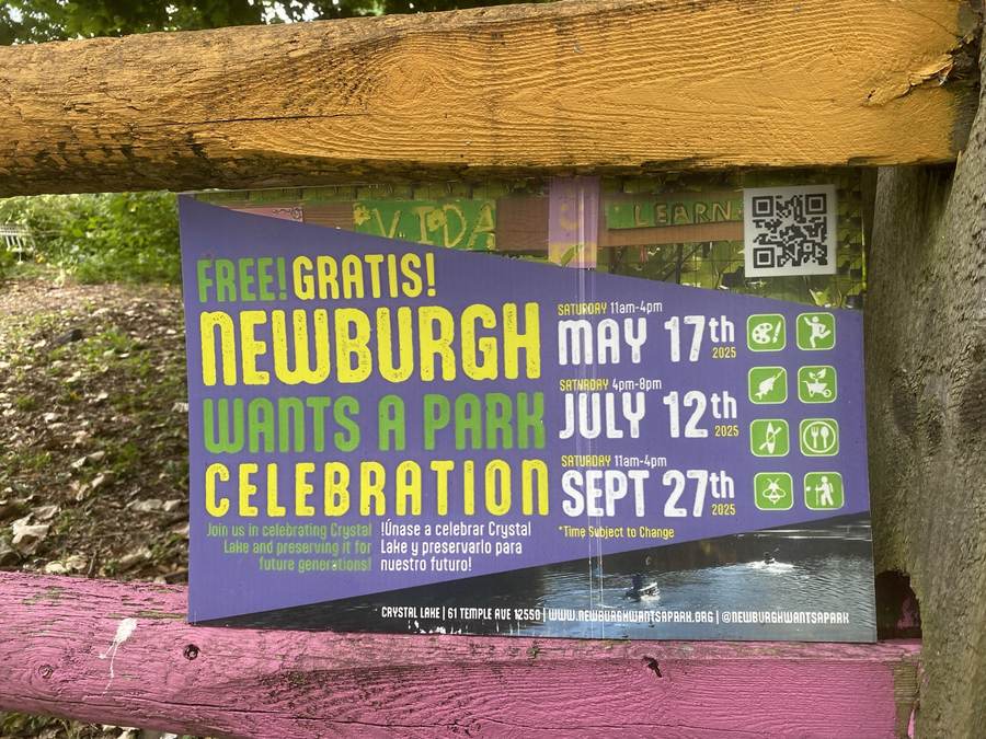 A community sign in the garden reading Newburgh Wants A Park