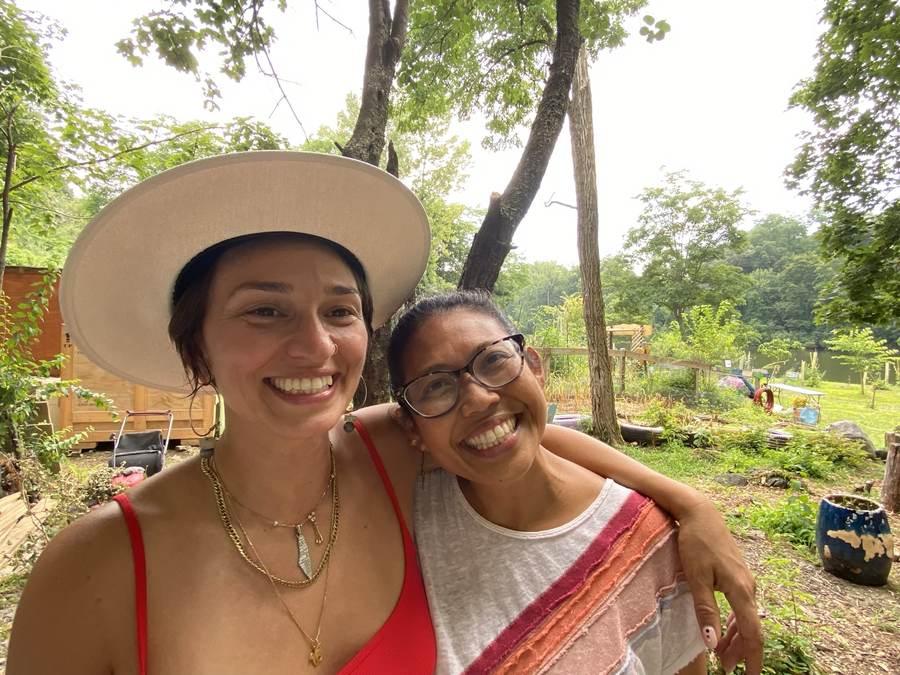 Two community members photographed together in the garden