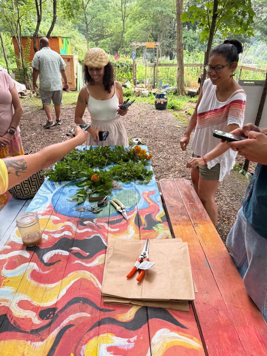 Painted community tables set up for a workday at the Sanctuary